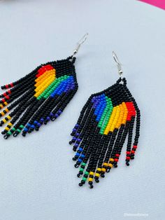 These Beaded Earrings are so colorful and perfect for all-day wear. They are definitely the perfect accessory to style up your look and add personality to your outfit. These lovely handmade earrings are made with sterling silver hooks and colorful beads. Each pair of earrings that we sell is authentic and one-of-a-kind! Finds more styles at https://www.etsy.com/shop/LatinxsCulturaViva?ref=simple-shop-header-name&listing_id=990207426&section_id=26730499 Bohemian Multicolor Heart Beaded Earrings, Bohemian Multicolor Heart-shaped Beaded Earrings, Handmade Multicolor Heart Beaded Earrings, Handmade Multicolor Heart-shaped Beaded Earrings, Multicolor Heart Beads Earrings For Gift, Adjustable Multicolor Heart Earrings, Multicolor Dangle Earrings With Heart Beads, Gift Multicolor Heart Beaded Earrings, Heart-shaped Multicolor Beaded Earrings