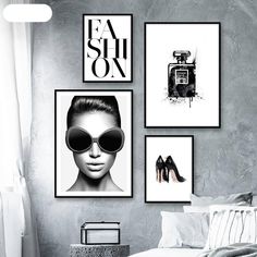 black and white photograph of woman's face with sunglasses on wall next to bed