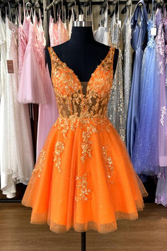 This short homecoming dress features an A-line silhouette and V-neck, with an open back and zipper closure. The tulle material is adorned with floral appliques and the above knee length provides a touch of elegance. All in a striking orange color. SKU: 3556 Orange color Tulle material A-line silhouette V neck Floral appliques Above knee length Open back with zipper Ship in 7-10 business days Size: US 2-16. We offer free returns in 7 days. Please refer to our return policy page for more details. If you have any questions, don't hesitate to contact us: at service@dressesforparty.com. Orange And Pink Homecoming Dress, Orange Fall Dresses, Neon Orange Hoco Dress, Neon Homecoming Dresses, Orange Hoco Dress, Short Orange Dress, Senior Hoco, Tea Length Cocktail Dresses, Orange Homecoming Dresses