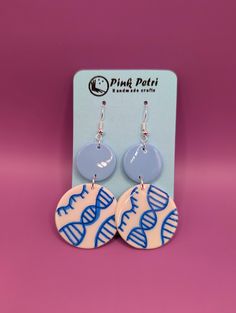 DNA and the colour blue- why not put them together and wear them on an earring?! Don't worry, these earrings are not made with real DNA but instead feature vegan-friendly polymer clay and 925 Sterling Silver hooks. Length is ~5cm, width is ~3cm. This is a handmade product so each earring will be unique, and just like your streak plates, there will be variations! To keep these earrings safe, please do not get them wet or store them in humid environments. No need to store them in the -80! Dna Earrings, Vegan Friendly, Handmade Crafts, Don't Worry, Favorite Jewelry, Jewelry Earrings Dangle, Aura, Etsy Earrings, Porter