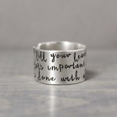 "This charming sterling silver inspiration ring is the perfect reminder. So fill your heart with what's important...and be done with all the rest. Hammered Silver Ring Measurements & Features: ♥ 1/2\" wide ♥ Tumbled & polished .925 sterling silver PureImpressions.etsy.com makes these charming stamped silver feather rings, as well as other hand stamped jewelry with love one at a time in the heart of Wyoming." Inspirational Silver Promise Ring, Adjustable Inspirational Sterling Silver Rings, Inspirational Adjustable Sterling Silver Rings, Inspirational Silver Rings For Anniversary, Meaningful Silver Ring As Gift, Meaningful Silver Rings As Gifts, Inspirational Personalized Sterling Silver Rings, Meaningful Sterling Silver Promise Ring, Meaningful Sterling Silver Ring For Anniversary