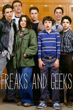 a group of people standing in front of lockers with the words freaks and geeks on them