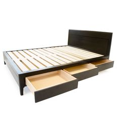 a bed with two drawers underneath it on a white background and the bottom drawer is open