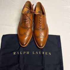 Ralph Lauren Purple Label Sully Lace Up Oxfords Loafers Dress Shoes: 39.5b Made In Italy. Offers Are Welcome. Please Check The Please Check The Measurements In The Photos. Moreover The Manufacturer Measurements Can Be Seen In The Pictures. Ralph Lauren Purple Label Sully Lace Up Oxfords Loafers Dress Shoes Wing Tip: 39.5b Made In Italy Brown Cognac Tapered Toe Leather In Excellent Condition Size 38.5 B, Which Equates To ~7.5 Us Sizing But Please Confirm Measurements I Include In Pictures And Do Elegant Lace-up Shoes With Rubber Sole For Business Casual, Elegant Lace-up Leather Shoes For Work, Spring Gala Leather Oxfords, Wingtip Lace-up Shoes With Leather Lining For Work, Elegant Lace-up Shoes With Leather Sole For Work, Spring Gala Dress Shoes With Leather Sole, Elegant Spring Lace-up Shoes With Rubber Sole, Plain Toe Dress Shoes For Spring Galas, Spring Gala Plain Toe Dress Shoes