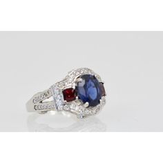 This is part of Chairish’s Fine Jewelry assortment.  Sapphire Ruby Diamond Ring 18K White Gold  This lovely Sapphire Ruby Diamond Ring is set in 14K White Gold. It features a Oval cut Sapphire weighing in at 2.67 Carats, flanked by 2 Rubys square cut and weighing 0.70 carats and White Diamonds, F-G, VS weighting in at 2.50 Carats. Set in a square shank mounting, measuring approximately 15mm tapering to 2.4mm Size 6.5. Total weight: 5.87 carats. I purchased this to go with many of my Tutti Frutti Luxury Multi-stone Sapphire Cluster Ring, Formal Fine Jewelry Sapphire Cushion Cut Ring, Luxury Ruby Ring With Multi-stone Round Cut, Luxury Multi-stone Round Cut Ruby Ring, Luxury Round Cut Multi-stone Ruby Ring, Luxury Multi-stone Cushion Cut Ring, Formal Cushion Cut Sapphire Ring, Formal Luxury Cluster Ring With Cushion Cut, Multi-stone Platinum Sapphire Ring For Anniversaries