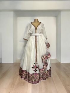 Beautiful Ethiopian and Eritrean Habeshan Dress. Stylish Menen, 100% Cotton We recommend hand washing and air drying to make it last longer. A low heating iron will also keep design and look. Cotton, it doesn't have a pocket. Ethiopian New Year, New Year Dress, Eritrean Dress, Beautiful Ethiopian, Ethiopian Clothing, Cultural Fashion, Ethiopian Dress, Habesha Kemis, Beautiful Braided Hair