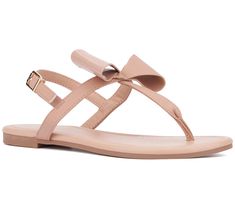 Elevate your summer wardrobe with the Abril flat sandal, where comfort meets effortless chic style. Adorned with textured bow details for a touch of femininity, this sandal is perfect for everything from beach days to casual strolls around town. From New York & Company. Summer Bow Flip Flops With Open Toe, Trendy Beach Sandals With Bow, Casual Summer Flip Flops With Bow, Summer Beach Flip Flops With Bow, Flat Sandals With Bow For The Beach, Adjustable Bow Sandals For Beach, Summer Sandals With Bow And Adjustable Straps, Summer Adjustable Bow Sandals, Adjustable Bow Sandals For Summer