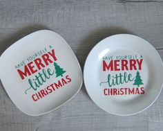 two plates with merry little christmas designs on them