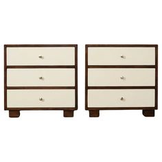 two white and brown dressers side by side with drawers on the bottom, one is closed