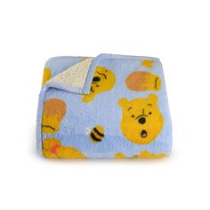 a blanket with winnie the pooh on it