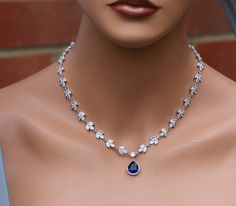 I made this beautiful necklace with zirconia stone and blue drop zirconia . necklace is 16 '' long . and comes with 2 option 1 with 2'' extender chain and close with lobster clasp . and other option is back drop which is 6 inches long . link for matching bracelet https://www.etsy.com/uk/listing/233271555/bridal-jewelry-bridal-bracelet-wedding?ref=shop_home_active_5 matching earrings , https://www.etsy.com/uk/listing/236212847/clear-zirconia-bridal-earring-long?ref=shop_home_active_95 Necklace For Bride, Necklace Prom, Prom Necklace, Sapphire Jewelry Set, Ethereal Jewelry, Statement Jewelry Necklace, Blue Jewelry Set, Blush Earrings, Prom Necklaces