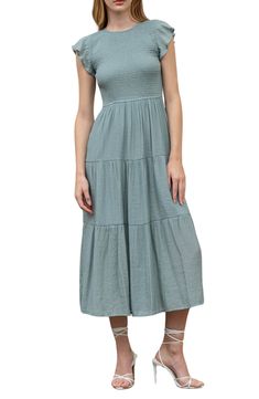 An elegant A-line midi dress is fashioned with fluttery cap sleeves, a smocked bodice and a gracefully tiered silhouette. 48" length (size S) Jewel neck Cap sleeves Back keyhole with button-loop closure Smocked bodice Tiered design Fully lined Shell: 62% rayon, 38% polyester/lining: 100% polyester Hand wash, dry flat Imported Model stats: 5'10" height, 32" bust, 25" waist, 36" hip. Model is wearing size S. Tiered Midi Dress, Jewel Neck, Flutter Sleeve, Cap Sleeves, Smocking, Nordstrom Rack, Bodice, A Line, Hand Wash