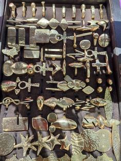 a box filled with lots of different types of metal items