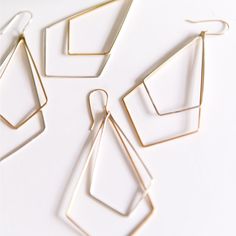 Chevron shapes, contrasting metals and a dangling design makes for subtle drama on these earrings. Earring length: 2.5 inches Available in sterling silver or 14k gold filled. Gold Geometric Earrings For Everyday, Modern Teardrop Chandelier Earrings, Geometric Gold Nickel-free Jewelry, Nickel-free Geometric Gold Jewelry, Gold Geometric Nickel-free Jewelry, Minimalist Geometric Pierced Jewelry, Modern Gold Teardrop Chandelier Earrings, Minimalist Geometric Jewelry, Modern Brass Chandelier Earrings