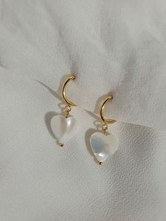 White Heart-shaped Pearl Charm Earrings, White Dangle Heart Earrings With Ear Wire, Cute White Huggie Jewelry, White Heart-shaped Pearl Earrings For Pierced Ears, Dainty Heart Charm Dangle Huggie Earrings, Heart-shaped White Pearl Earrings For Pierced Ears, White Dainty Earrings With Heart Charm, White Heart-shaped Pearl Earrings Gift, White Drop Earrings With Heart Charm