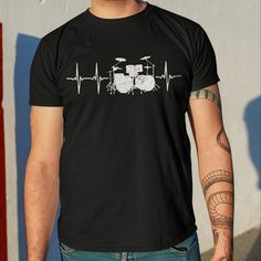 Unisex T-Shirts runs fitted. Please order a size up for a looser fit Drums Heartbeat Graphics: Perfect clothing for drummers who play drums in the band or someone you know who likes a lot about drumming or any drumbeat makers. Complete your drummer modern boy percussionist headphone stool gloves, sticks, shoe earplugs with these clothes! Great gift for teens or beginner band drummer who likes to do some beat and solo drum rhythm and rolls! This classic unisex jersey short sleeve tee fits like a Music-themed Graphic Print Short Sleeve Shirt, Music-themed Short Sleeve Top With Screen Print, Fitted Music-themed Top With Crew Neck, Fitted Black Music-themed Top, Unisex Short Sleeve Music-themed Top, Unisex Rocker Style Crew Neck T-shirt, Music-themed Band Logo Tops With Short Sleeves, Rock Style Cotton Crew Neck Shirt, White Short Sleeve Rocker Tops