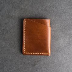 This is the best wallet you’ll ever own. The Card Holder Wallet will hold your essentials while looking great. The leather will gain a beautiful, unique patina over time as you put your wallet to good use. SPECS Wallet Size: 3.75" x 3" Wallet Thickness: .375" Leather Color Options: Choose from Whiskey, Café, Espresso, Black, Green, Red, or Plum Personalization Character Ranges: Choose the range you need from No personalization, 1-3 Initials, or 4-9 Characters Holds 6 cards plus some folded cash Roman Fonts, Leather Card Holder Wallet, Personalized Leather Wallet, Best Wallet, Minimalist Wallet, Type Setting, Card Holder Wallet, Small Wallet, Card Holder Leather