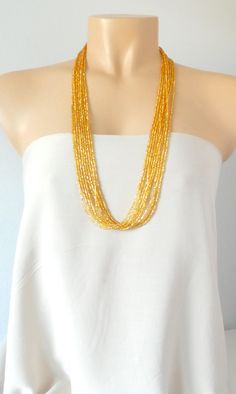 "This stunning necklace is perfect for a party or to simply make you shine anytime you need some spark on you! You can wear it simple or twisted. The seed bead is very sparkly and drapes beautifully. This necklace also comes with 20 strands: https://www.etsy.com/listing/155453194/gold-necklace-sparkly-gold-necklace Please read specifications on SIZES below: ❤ SIZES This item comes in several sizes, kindly choose at checkout. The easiest way to find out which length suits you best is to measure a Handmade Double Strand Beaded Necklace For Party, Elegant Multi-strand Necklaces For Summer, Elegant Multi-strand Necklace For Summer, Elegant Multi-strand Necklace With Tiny Beads, Elegant Beaded Necklaces With Faceted Beads For Summer, Elegant Summer Beaded Necklaces With Faceted Beads, Elegant Summer Beaded Necklace With Faceted Beads, Elegant Beaded Choker For Summer, Gold Multi-strand Beaded Necklaces For Summer