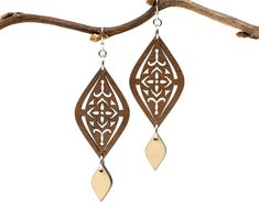 "A Moroccan tile-inspired design gives these earrings a worldly vibe, and a dangling charm adds elegance. Two tones of intricately cut wood - walnut and maple - give additional texture to the piece. Laser cut wood earrings can be dressed up or down, making them the perfect complement to any outfit! These earrings are strong but so lightweight and comfortable, you will hardly know you have them on! Pair with the matching Moroccan necklace for a coordinated look: https://www.etsy.com/listing/81235 Elegant Brown Pierced Teardrop Earrings, Elegant Brown Teardrop Pierced Earrings, Elegant Brown Plug Earrings As Gift, Elegant Brown Plug Earrings For Gift, Laser Earrings, Moroccan Necklace, Laser Cut Wood Earrings, Laser Cut Earrings, Cut Earrings