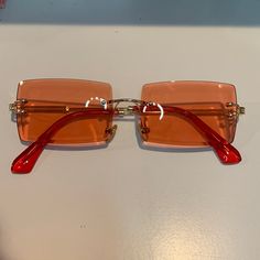 Brand New & Never Worn! Comes With Case! Red Rimless Sunglasses For Party, Red Square Frame Sunglasses For Party, Casual Red Sunglasses For Spring, Red Sunglasses For Spring Beach Occasions, Red Square Frame Sunglasses For Beach, Casual Orange Rectangular Sunglasses, Red Sunglasses For Beach In Spring, Red Rectangular Sunglasses For Summer, Red Sunglasses With Gradient Lenses For Spring