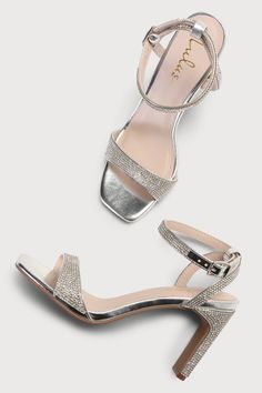 Every fashionable cutie needs a pair of the Lulus Kaylena Silver Rhinestone Ankle Strap High Heel Sandals! A sparkling silver rhinestone construction shapes these party-ready heels that feature a square toe bed with a dainty toe strap. A wrapped blade heel rises to a chic matching ankle strap that wraps around and secures with a shiny silver buckle. 3. 25" wrapped blade heel. Cushioned insole. Rubber sole has nonskid markings. Man Made Materials. Imported. Lulus | Kaylena Silver Rhinestone Ankle Bedazzled Ankle Strap Sandals For Party, Glamorous Open Heel Sandals With Rhinestones, Glamorous Rhinestone Sandals For Events, Glamorous High Heel Bedazzled Sandals, Glamorous Bedazzled High Heel Sandals, Summer Bedazzled Heels With Ankle Strap, Sparkling Low Heel Sandals For Party, Glamorous Low Heel Sparkling Sandals, Event Sandals With Rhinestones And Round Toe