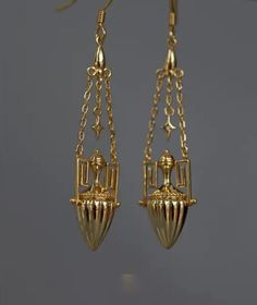 These stunning 18kt gold-plated Egyptian tassel earrings exude a timeless elegance and an exotic allure. The earrings is coated in 18kt gold, providing a rich, warm luster that highlights the elaborate craftsmanship. Victorian Gold Chandelier Earrings In Brass, Luxury Gold Plug Earrings For Formal Occasions, Victorian Gold Plug Earrings, Elegant Gold Plated Plug Earrings For Formal Events, Elegant Gold Plated Plug Earrings For Formal Occasions, Formal Luxury Gold Plug Earrings, Elegant Formal Tassel Drop Earrings, Antique Gold Chandelier Earrings In Brass, Antique Gold Chandelier Earrings