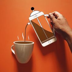 a person is pouring coffee from a cup into a cell phone with an image on the screen