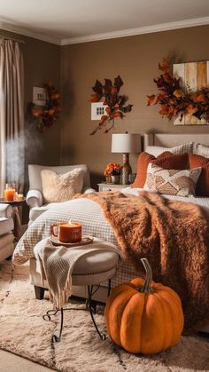 a bedroom decorated in fall colors with pumpkins on the bed, and other decorations