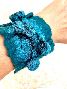 Handmade Wool bracelet. Felted  beautiful  wrist  cuff/bracelet. Elegant wool jewelry is beautiful and one of kind. Handmade  natural  bracelet is warm and soft.  I created it from merino wool 100% in wet felting technique in my pet-and smoke-free studio. In this bracelet I used Shibori technique to create unique felt texture. Such an accessory will be both a great addition for your look and wonderful gift idea. Length: about 9.0 inches Width: about 2.5 inches For wrist circumference approximate Artistic Cuff Bracelet As Gift, Blue Handmade Wearable Art Bracelet, Blue Handmade Wearable Art Bracelets, Handmade Artisan Blue Cuff Bracelet, Artisan Handmade Blue Cuff Bracelet, One Of A Kind Bangle Bracelet, Wearable Art Style, Unique Handmade Turquoise Bangle, Unique Blue Bangle Cuff Bracelet, Artisan Handmade Blue Bangle