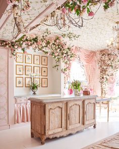 an image of a room with flowers hanging from the ceiling