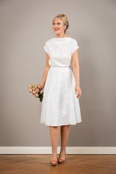 "Our bridal top Aennie is a simple, elegant top made of extremely delicate viscose fabric, with trimmed sleeves and a flowing neckline. Made of extremely delicate creamy white viscose fabric. With our Aurelie, Valerie or Livia bridal skirts, Aennnie is a wonderful top for the registry office or your summer wedding. Size / dimensions / weight \"Naomi\" is available in sizes 36-42. For other sizes, please just ask! used material 100% viscose Care instructions: machine washable at 30 degrees, iron Bridal Skirts, Bridal Tops, Wedding Skirt, Wedding Top, Lovely Tops, Viscose Fabric, Simple Weddings, Summer Wedding, Bridal Gowns