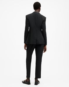 Structure is key to tailoring. Play with proportions in the Sister Pants. The tapered-leg silhouette has been expertly constructed from a soft woven fabric made in Europe by tailoring leader, Riopele. They're complete with contrast satin side panels for a sophisticated look. Off somewhere fancy? Double up with the matching blazer.  These pants are designed to a tailored fit Zip closure Mid-rise Tapered leg Contrast satin side panels Four pockets Pair with the Sister Blazer Elegant Fitted Pantsuit With Tapered Leg, Fitted Office Pantsuit With Structured Boning, Tapered Leg Pantsuit With Pressed Crease For Work, Modern Structured Pants For Workwear, Fitted Pantsuit With Welt Pockets For Workwear, Structured Tuxedo Style Fitted Pantsuit, Fitted Tuxedo Style Structured Pantsuit, Fitted Tuxedo-style Structured Pantsuit, Modern Fitted Pantsuit For Work