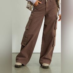 Never Worn, Low Rise, Cargo Pants. Trendy Full-length Brown Cargo Pants, Trendy Brown Full-length Cargo Pants, Trendy Brown Full Length Cargo Pants, Casual Brown Wide Leg Pants With Pockets, Brown Cargo Style Wide-leg Pants, Brown Wide-leg Cargo Pants With Pockets, Trendy Brown Wide Leg Pants With Pockets, Spring Brown Wide Leg Cargo Jeans, Brown Baggy Cargo Pants