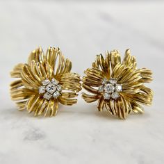 Unique and detailed Chrysanthemum flower earrings in 18K yellow gold. Featuring 3/4 of a carat in clean Old European Cut diamonds. Omega backs work securely with no issues to note. Fully tested, polished and ready to wear. We are a brick and mortar store located in Alhambra, CA. All items are guaranteed as described. SPECIFICATIONS: Diamond: .75ctw / VS - SI H - I Color / Old European Cut Measurement: 1 in diameter each Total Weight: 17.7 grams These earrings have been inspected by professionals Gold Diamond Flower Earrings For Formal Occasions, Formal Gold Diamond Flower Earrings, Formal Yellow Gold Flower Earrings, Formal Yellow Gold Cluster Earrings In Flower Shape, Formal Yellow Gold Flower Earrings With Prong Setting, Yellow Gold Flower Cluster Earrings For Anniversary, Yellow Gold Flower-shaped Clip-on Earrings For Formal Events, Formal Gold Flower Cluster Earrings, Classic Yellow Gold Flower Earrings For Formal Occasions