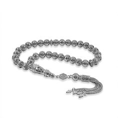 925 Sterling Silver Filigree Art Tasbih Unveil an unparalleled blend of spirituality and elegance with our intricately designed 925 Sterling Silver Filigree Art Tasbih. This iconic piece is more than just an accessory; it's a testament to masterful craftsmanship and profound devotion. Details and Craftsmanship: Each bead, accompanied by its gleaming silver chain, is carved from authentic 925 Sterling Silver, echoing an unparalleled attention to detail. The tasbih beads are carefully fashioned wi Spiritual Silver 8mm Beads, Silver Beaded Rosary With Spiritual Style, Silver Beaded Spiritual Rosary, Spiritual Silver Beaded Rosary, Silver Beaded Bracelets With 108 Round Beads, Spiritual Silver Rosary Bracelet With Polished Beads, Handmade Silver Rosary Bracelet With Round Beads, Silver Jewelry With 108 Round Beads, Silver Rosary Bracelet With Polished Round Beads