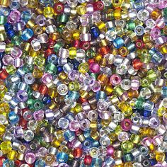 many different colors of beads are shown in this image and it looks like they have been made out of glass