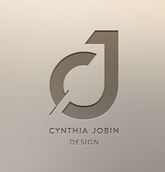 the logo for cynthia jobin design is shown in grey and white colors