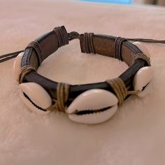 New Without Tags! Hand Crafted Thick Brown Leather Conch Shell Adjustable Bracelet. String Pull Closure. Purchased In Caribbean As A Men’s Bracelet. Unisex. Circumference Fully Closed: 9” Circumference Fully Open: 12” Width: 1/2” I Accept Reasonable Offers & Offer Bundle Discount On 2+ Items! To Bundle: Hit Bag Icon Below Each Item And You’ll Automatically Receive The 20% Discount! Casual Brown Leather Beach Bracelet, Shells Bracelet, Conch Shells, Bracelet String, S Bracelet, Shell Bracelet, Bag Icon, Conch Shell, Conch