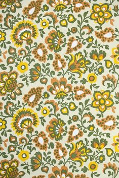 an orange, yellow and green floral pattern on white fabric