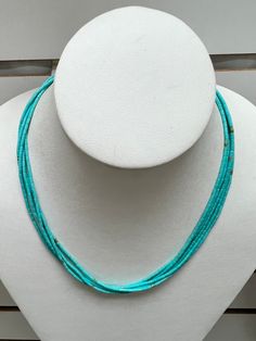 Vibrant, Southwestern, and versatile beaded Turquoise Heishi necklace. This necklace is lightweight and comfortable, making it ideal for everyday wear. It adds a pop of color and a Southwestern vibe to your outfit. You can pair this simple Turquoise necklace with anything.  All findings are 925 sterling silver. Measurements: 2x3mm turquoise tube beads. The necklace is a 5 strand beaded necklace with a lobster claw clasp.   Handcrafted in the USA. The necklace will be packed securely in a gift box.  Thanks for looking! Southwestern Turquoise Necklace With Tiny Beads, Collier Heishi, Turquoise Sterling Silver Hand-strung Necklace, Hand-strung Silver Turquoise Necklace, Unique Silver Turquoise Hand-strung Necklace, Hand-strung Turquoise Necklace With Sterling Silver Round Beads, Adjustable Southwestern Hand-strung Turquoise Necklace, Heishi Necklace, Tube Beads