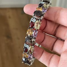 This An Absolutely Gorgeous Multi Gemstone Heavy Solid Sterling Silver Bracelet. Made With Over 150 Carats Of Faceted Blue Topaz, Amethyst, Citrine, Lemon Quartz, Smoky Quartz, And Garnet. The Stones Are Set On Heavy Solid Sterling Silver. Stamped 925 On Its Catch. Measures 7.5 Inches Long And 0.5 Inch Wide. In Excellent Vintage Condition. Lemon Quartz, Sterling Silver Bracelet, Smoky Quartz, Sterling Silver Bracelets, Womens Jewelry Bracelets, Blue And Silver, Vintage Silver, Blue Topaz, Citrine