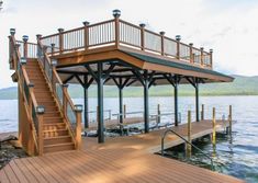 a wooden dock with steps leading to the water