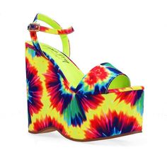 Say hello to POP! Tie-dye platform wedges with a fabric top, and man-made sole, and excellent for any woman wishing to add a bright, exciting flair to her wardrobe. They're simple to put on and off thanks to their ankle strap fastening and slip-on design, making them ideal for everyday wear. The tie-dye pattern gives any ensemble a distinctive and playful touch, and the higher platform makes them both cozy and fashionable. These wedges are likely to draw attention because they are imported for a Fabric Wedge Sandals For Summer, Bold Summer Sandals With Wedge Heel, Summer Platform Sandals With Fabric Material, Bold Wedge Heel Sandals For Summer, Bold Summer Platform Wedge Sandals, Bold Platform Wedge Sandals, Bold Platform Wedge Sandals For Summer, Summer Trendy Fabric Heels, Trendy Summer Fabric Heels