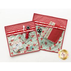 two red and green bags with sewing supplies in them