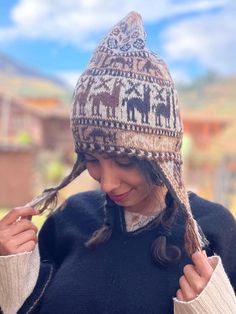 Andean alpaca wool beanie. This beautiful beanie is made by Hilaria from the Chahuaytire community, a part of the Quechua people living in the Sacred Valley of the Inka's in the Peruvian Andes.  ⛰️Chahuaytire community is known to be the best weavers among the Quechua people.  They maintain their ancestral knowledge of plants and weaving and bring it to the present.  🧵🦙They are involved in every part of making their products.  They have their own alpaca and lamas which they take care of, and obtain their wool out of. They make their own natural dies from indigenous plants belonging to their region.  🫶🏼They have a strong connection with nature and all of their designs are a reflection of the nature, The beanie has a very smooth soft feeling. It is not itchy like sheep wool. Cozy Alpaca Hats For Fall, Bohemian Winter Beanie, Casual Alpaca Winter Hat, Adjustable Cozy Brown Hat, Winter Alpaca Beanie Cap, Bohemian Wool Hat For Winter, Alpaca Winter Hat For Cold Weather, Winter Alpaca Hat For Cold Weather, Cozy Alpaca Beanie Hat