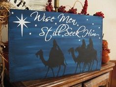 a wooden sign that says nice men, still rock him with three wise men riding on camels