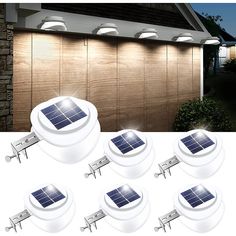 six solar powered motion sensor lights in front of a house