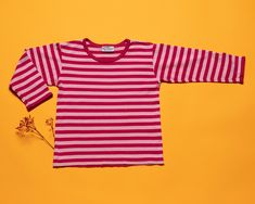 This is a vintage 00's MARIMEKKO striped jersey top in blue, made of cotton. Stripes could never be too much, right?! Vintage condition level: 8/10.* Shows overall wear. SIZE. Marked size: 100. Estimated size: approx age 3 - 4 years.  To be sure it would fit please check the measurements below.  FLAT Measurements: Length: 15" / 38 cm Armpit to armpit: 12" / 30.5 cm Shoulder to shoulder: 12" / 30.5 cm Sleeve: 12" / 30.5 cm SKU - M08 *We assess the condition of our vintage items on a scale from 1 Marimekko Vintage, Minimalist Top, Pink Jersey, Level 8, Finnish Design, Striped Jersey, Vintage Kids, Marimekko, Jersey Top