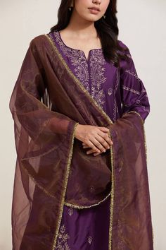 Purple natural weaves chanderi silk kurta with contrast paisley and floral embroidery. Comes with pant and shimmer organza dupatta.
Components: 3
Pattern: Embroidered
Type Of Work: Floral and Paisley
Neckline: Notched
Sleeve Type: Three Quarter
Fabric: Chanderi Silk, Shimmer Organza
Color: Purple
Other Details: 
Embroidered hem pant
Fringed border dupatta
Occasion: Puja - Aza Fashions Semi-stitched Silk Kurta For Designer Wear, Tussar Silk Sets With Sheer Dupatta In Traditional Drape, Tussar Silk Sets With Sheer Dupatta For Eid, Anarkali Cotton Silk Kurta With Embroidered Border, Transitional Silk Salwar Kameez With Zari Work, Designer Silk Kurta With Sheer Dupatta, Transitional Raw Silk Kurta With Dupatta, Designer Tussar Silk Salwar Kameez With Straight Kurta, Bollywood Style Silk Kurta With Zari Work