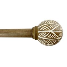 a wooden handle with an intricate design on it